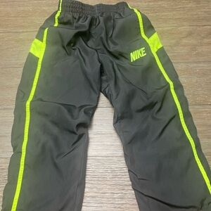 Nike warmup boy pants black green stripe and logo. Windbreaker pants size 3T